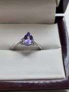 Very fine Tanzanite 1.44 ctw with diamond accent set in silver ring, GIA certified