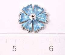 Blue Topaz Flower Pendant, 18KT. Total weight 5.3 grams.