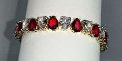 18 Kt Yellow Gold Plated Huge 32.5 Ctw Simulated Diamond and Ruby Tennis Bracelet