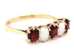 9kt Yellow gold oval opal and garnet 5 stone ring