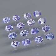 Heavy flashing 2.83ct oval cut Tanzanite set