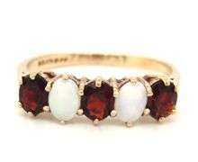 9kt Yellow gold oval opal and garnet 5 stone ring