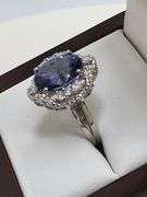 Very fine Tanzanite 5.34 ctw with diamond accent set in silver ring, EGL certified