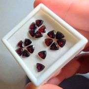 Stunning wine red 9.51ct trillion cut untreated Garnet set