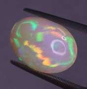 Full body flashing! Vibrant color! 6.99ct semi-black Opal!