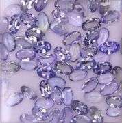 Untreated! Glittering 13.65ct oval cut Tanzanite set!