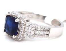 Blue cushion cut and white round cubic zirconia ring in 925 sterling silver