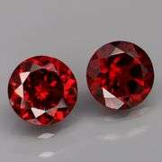 Mozambique red! 4.67ct matched round cut Garnet pair!