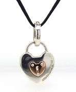 Tiffany & Co two tone Padlock pendant on black cord necklace