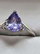 Very fine Tanzanite 1.44 ctw with diamond accent set in silver ring, GIA certified