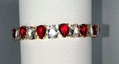 18 Kt Yellow Gold Plated Huge 32.5 Ctw Simulated Diamond and Ruby Tennis Bracelet