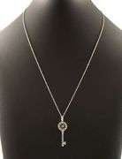 Tiffany & Co. 0.09ctw Diamond Flower Key Pendant Necklace in 18K