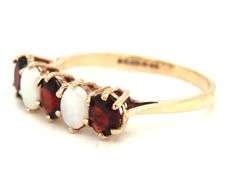 9kt Yellow gold oval opal and garnet 5 stone ring