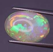 Full body flashing! Vibrant color! 6.99ct semi-black Opal!