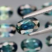 Heated only! 3.28ct blue green Sapphire set