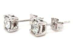 One pair of 14kt white gold 0.60ctw Illusion set diamond stud earrings