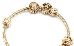 14kt Yellow gold Pandora bracelet with 10 charms