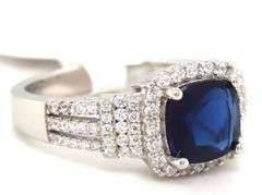 Blue cushion cut and white round cubic zirconia ring in 925 sterling silver