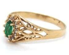 14kt Yellow gold marquise emerald and diamond ring
