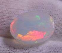 Multi-patterned! Smoldering color! 7.92 carats! Snow white Opal!