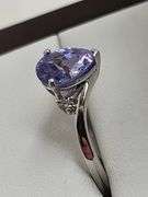Very fine Tanzanite 1.44 ctw with diamond accent set in silver ring, GIA certified