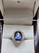 Very fine Tanzanite 5.34 ctw with diamond accent set in silver ring, EGL certified