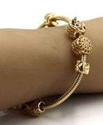 14kt Yellow gold Pandora bracelet with 10 charms
