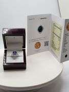 Very fine Tanzanite 5.34 ctw with diamond accent set in silver ring, EGL certified