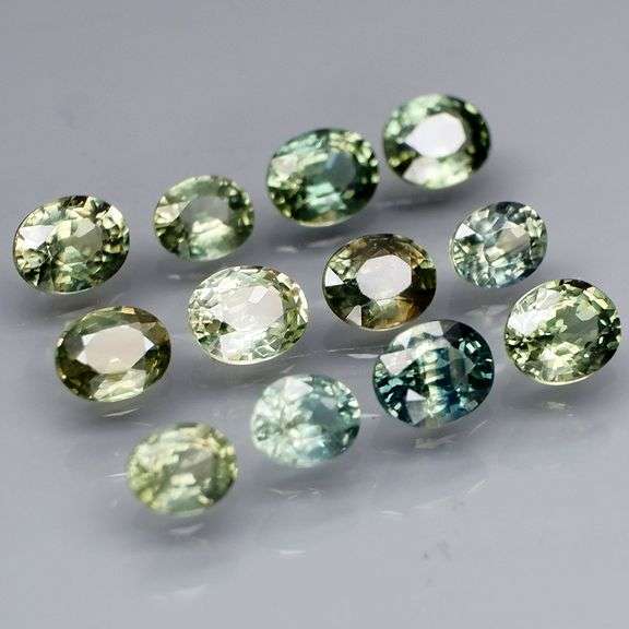 Awesome 3.43ct oval cut GREEN Sapphire set