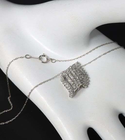 10kt White gold diamond cluster swirl pendant on chain