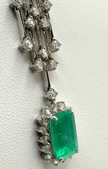 18k white gold tassel necklace with diamonds and emeralds