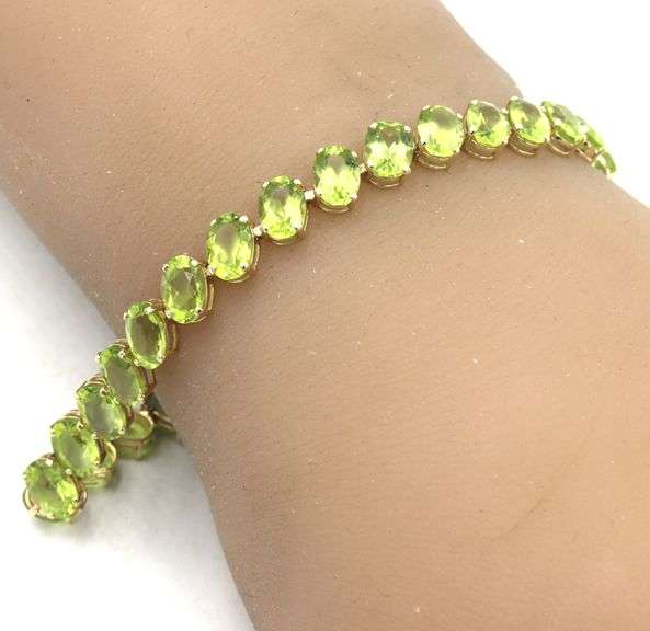 14kt Yellow gold 27.50ctw oval peridot bracelet