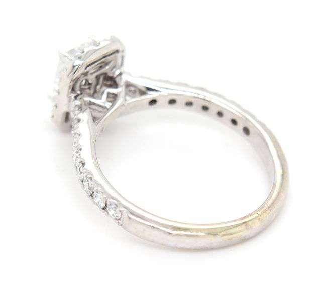 14kt White gold lab grown 0.65ct emerald cut in halo engagement ring
