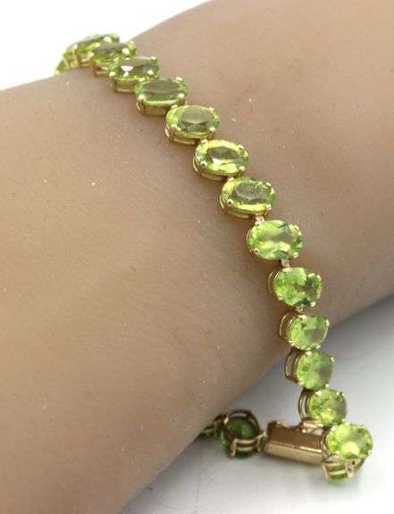 14kt Yellow gold 27.50ctw oval peridot bracelet