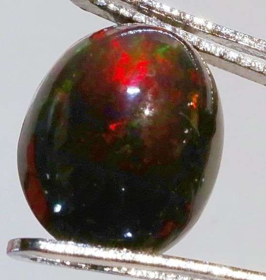 Glistening 1.89ct smoldering Black Opal