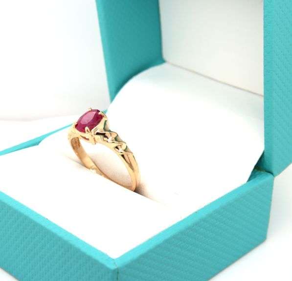 14kt Yellow gold oval ruby twisted shank ring