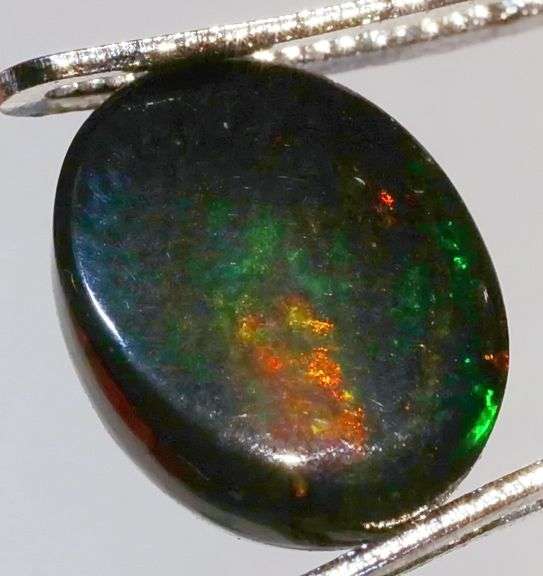 Glistening 1.89ct smoldering Black Opal