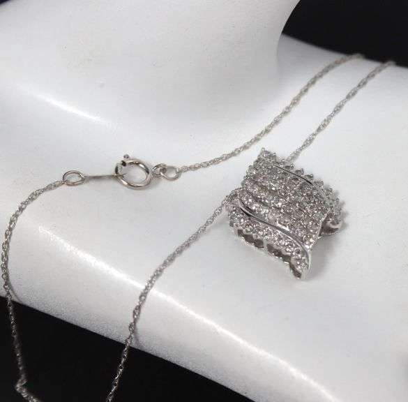 10kt White gold diamond cluster swirl pendant on chain