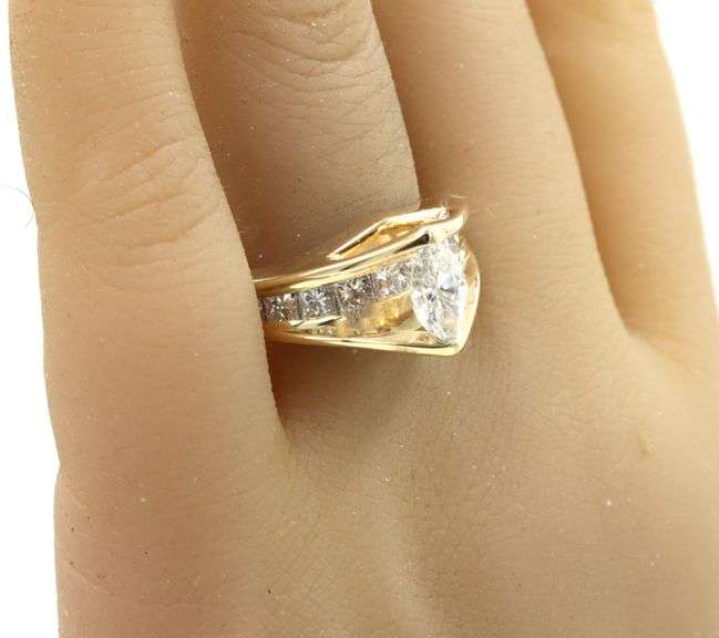 14kt Yellow gold 1.72ctw diamond ring with a tapered shank