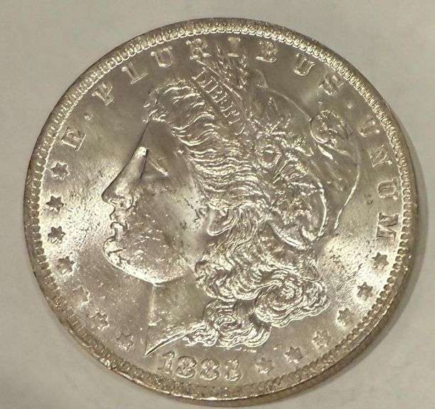 1883 O Frosty White BU Morgan Dollar