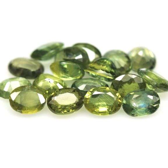 Heated only! 5.36ct blue green Sapphire set