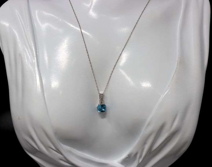 10kt White gold blue topaz and diamond pendant on chain