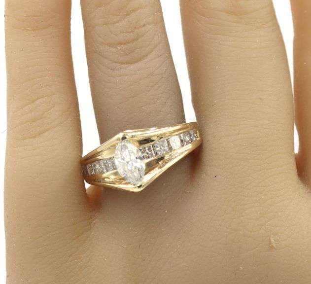14kt Yellow gold 1.72ctw diamond ring with a tapered shank