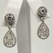 Fantastic diamond earrings pearl shape , 1 x .5 inch