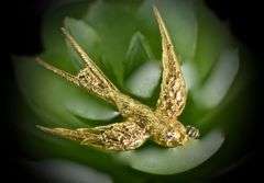 Beautifully Sculpted 18K Yellow Gold Swallow Brooch