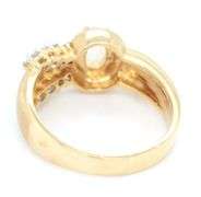 18kt Yellow gold oval moon stone and bezel diamond charm ring
