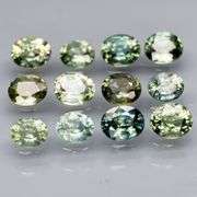 Awesome 3.43ct oval cut GREEN Sapphire set