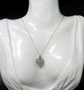 10kt White gold diamond cluster swirl pendant on chain