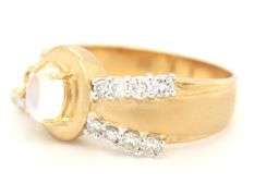 18kt Yellow gold oval moon stone and bezel diamond charm ring