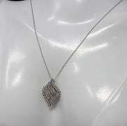 10kt White gold diamond cluster swirl pendant on chain